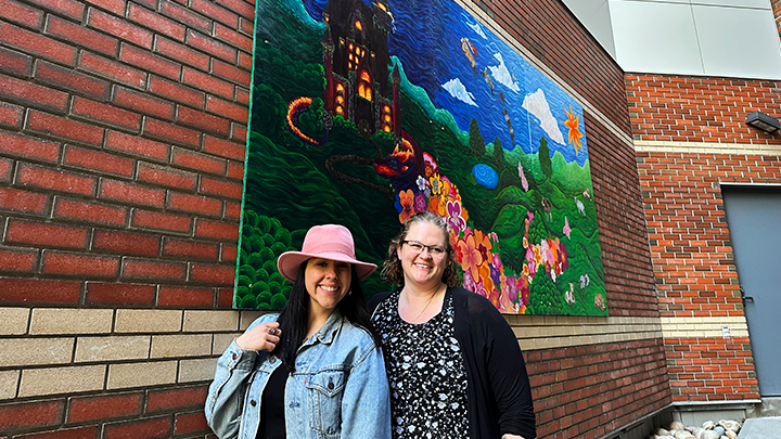 The reunification of childhood friends Lisa Rutter, a Licensed Practical Nurse at the Sturgeon Community Hospital, left, and art teacher Lindsay Bracken, helped to inspire the creation of a two-piece mural installation at the hospital in their hometown of St. Albert. 