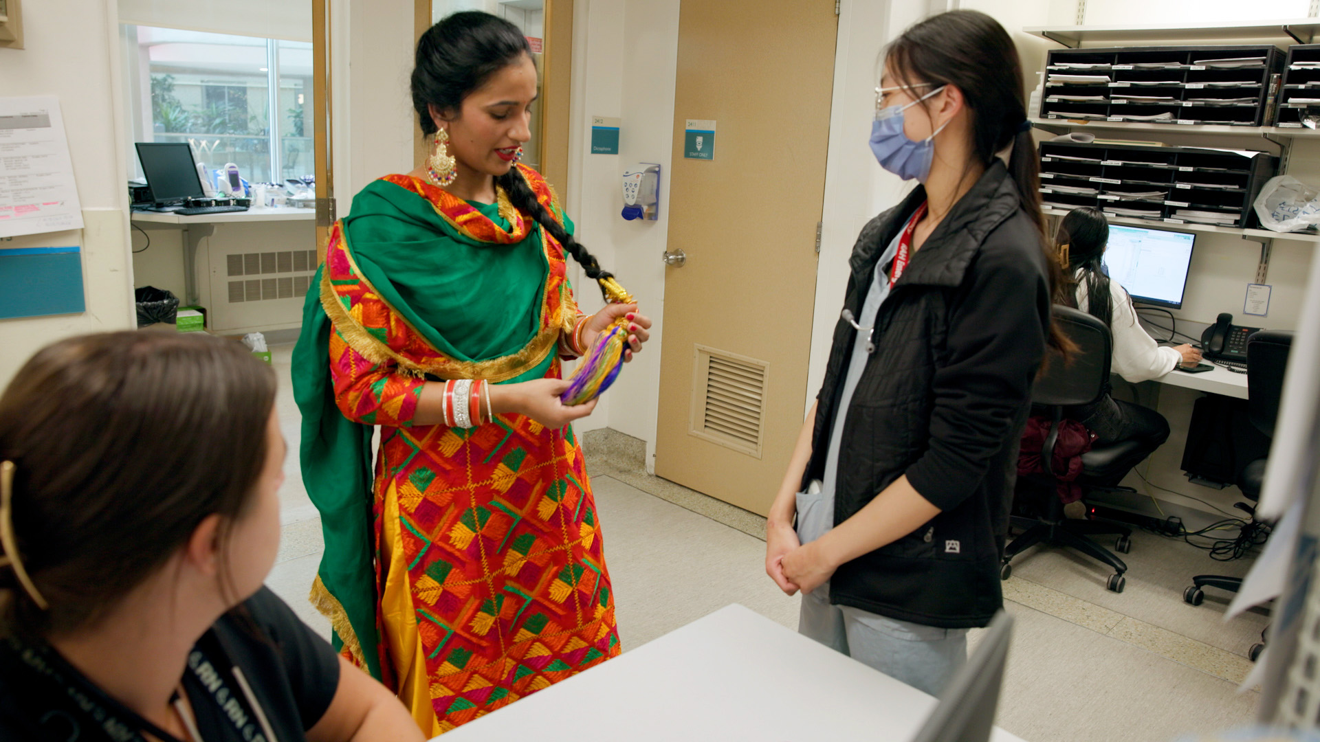 After performing an Indian folk dance as part of the Royal Alexandra Hospital’s Diversity Days celebration, registered nurse Simarjot Brah visited her colleagues on the surgery unit to share details about her traditional clothing.