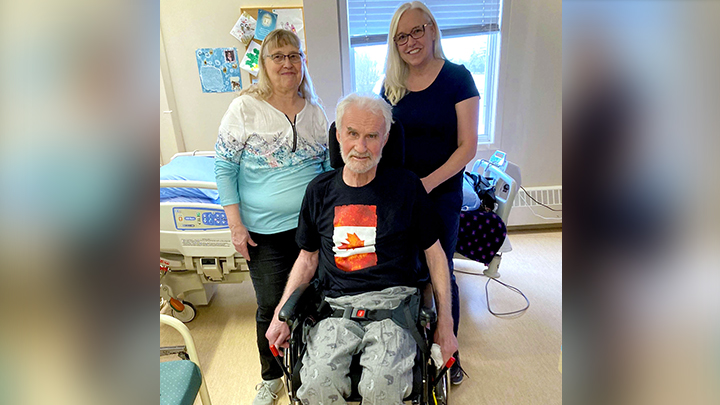 Harold Isaac and his wife Kathy, left, are pictured with therapy assistant Carla Engen. Here he tests a new wheelchair as part of an assessment pilot project held in Hythe and Beaverlodge earlier this year.